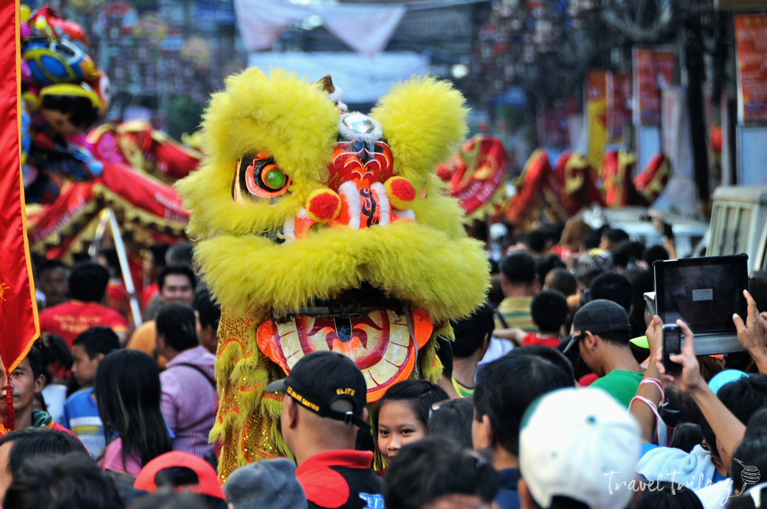 Dancing lion amidst the crowd of revelers during the Chinese New Year.